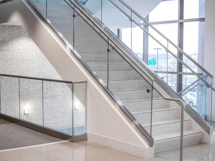 Stairs with a glass and steel railing